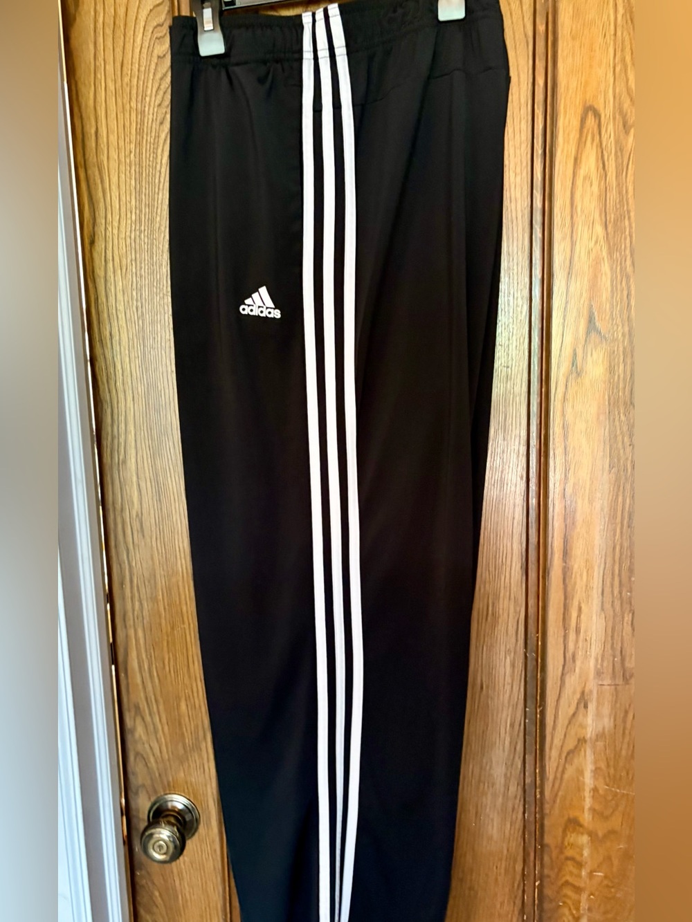 Men's size 2XLT Black Track Pants with White 3-Stripes.
Smoke and pet free home.